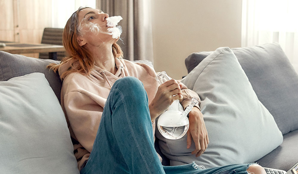 Woman Smoking From Her Bong