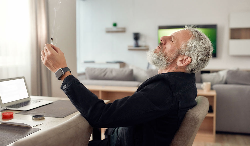 Old Man Relaxing Smoking Weed